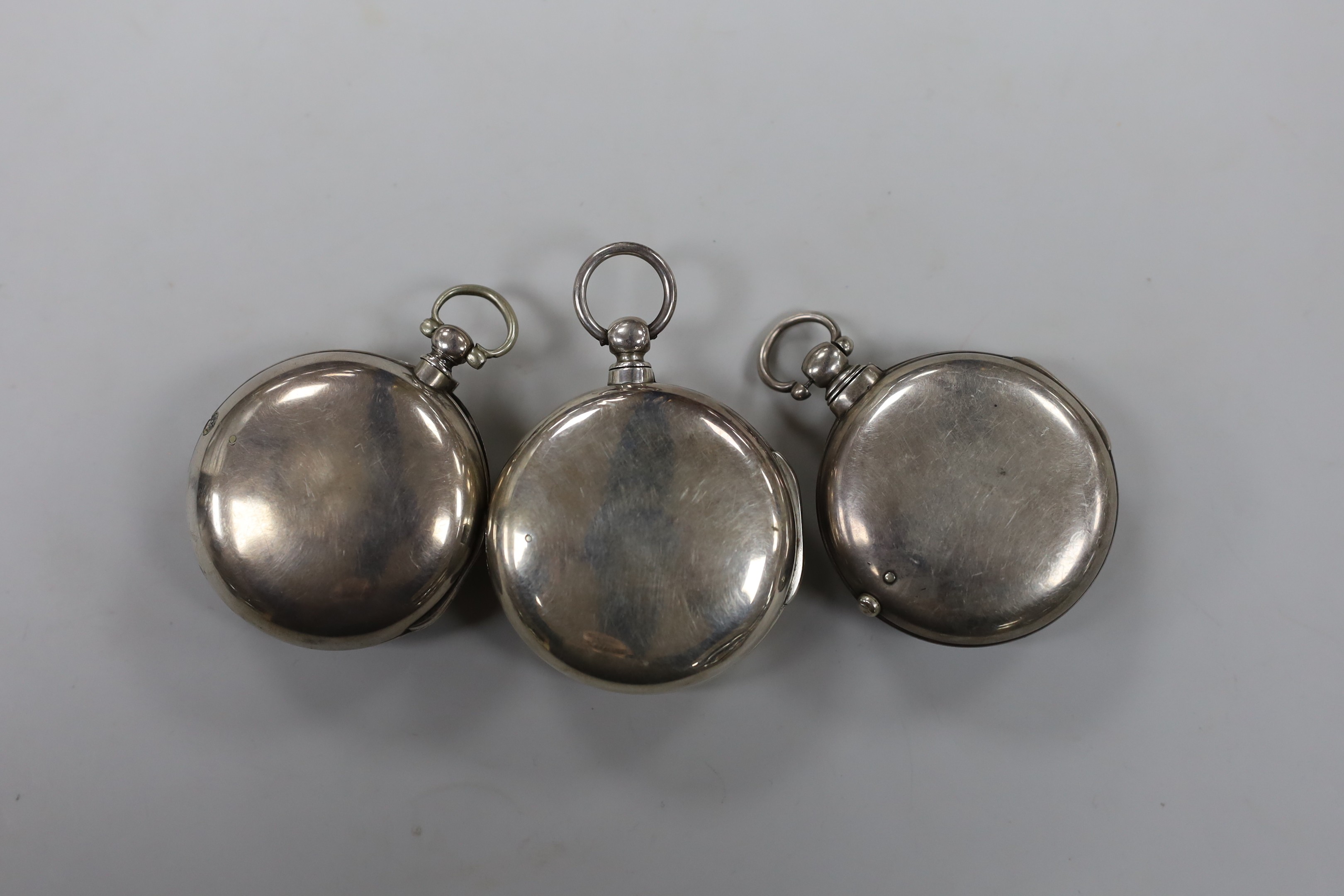 Three 19th century silver pair cased keywind verge pocket watches, by P. Matthew of Uckfield, the two others unsigned.